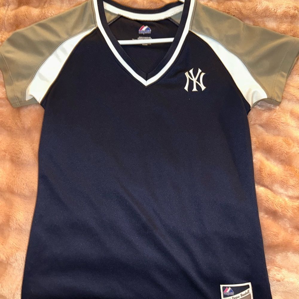 Authentic MLB Majestic blue and gray women’s Yankee jersey. Size small.